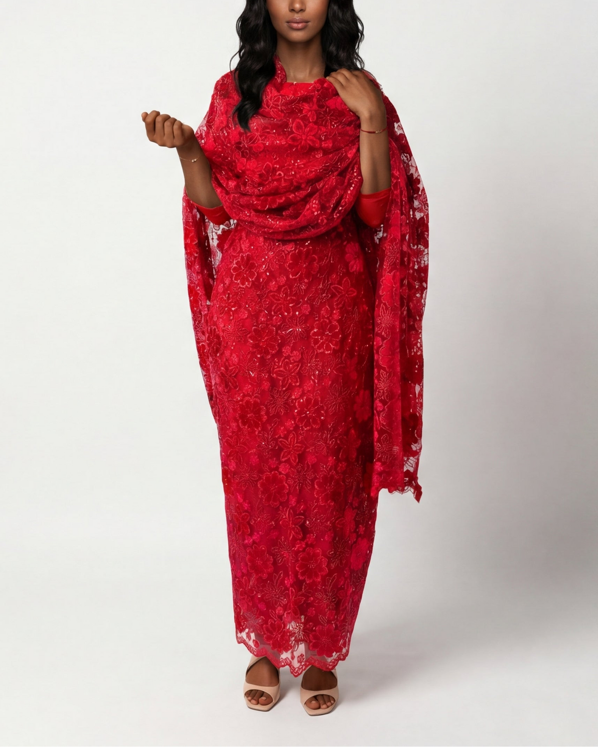 Red Sudanese Jirtig toub with dense floral velvet embroidery, front view worn draped