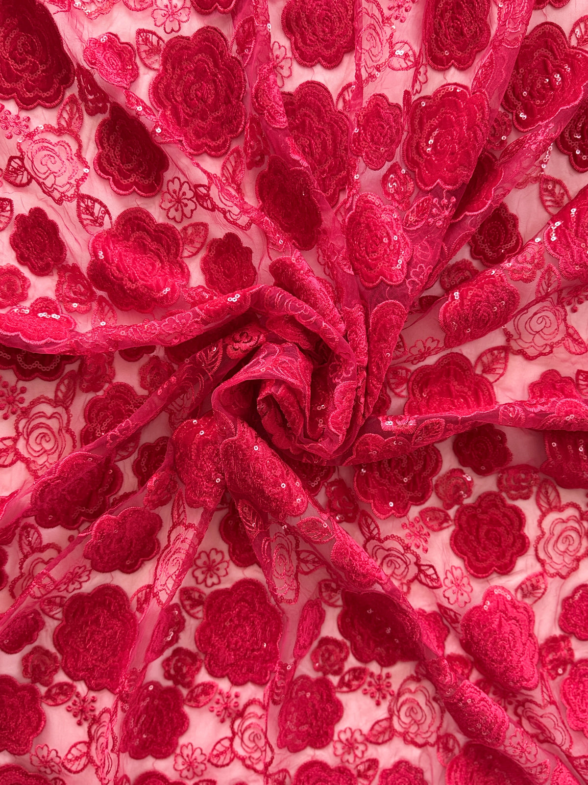 Close-up of raised crimson floral and sequin embroidery on Jumanah jirtig toub by Asalah