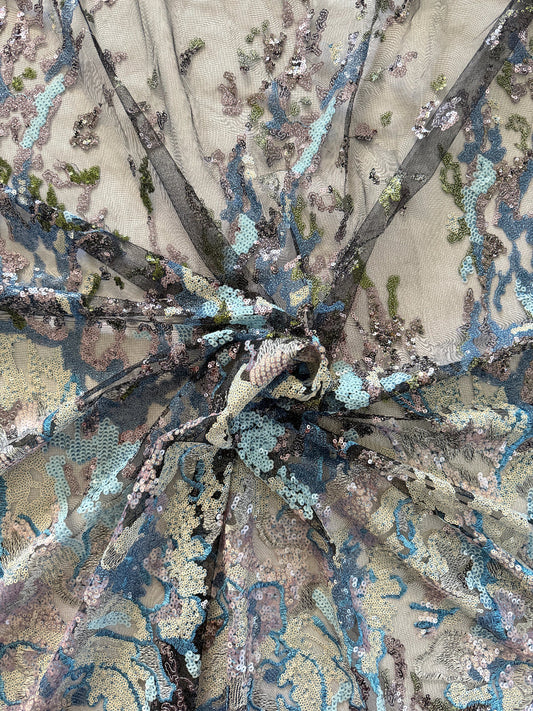 Close up of blue and silver sequin embroidery on Layl Sudanese toub