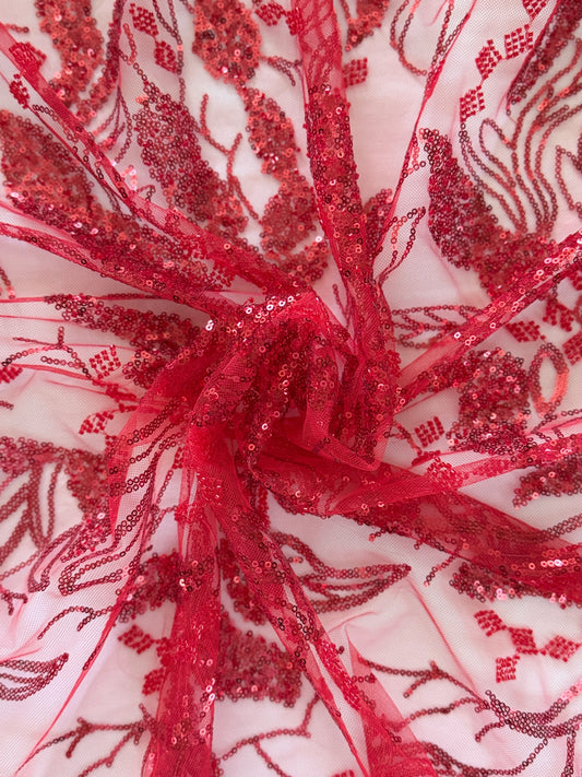 Close up of tonal red sequin botanical embroidery on Shafaq Sudanese toub