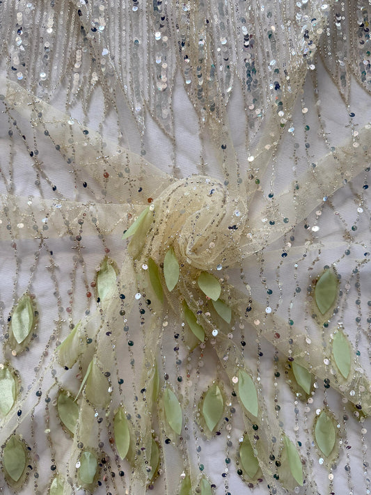 Close up of green fabric leaf applique and silver sequin lines on Warqah Sudanese toub