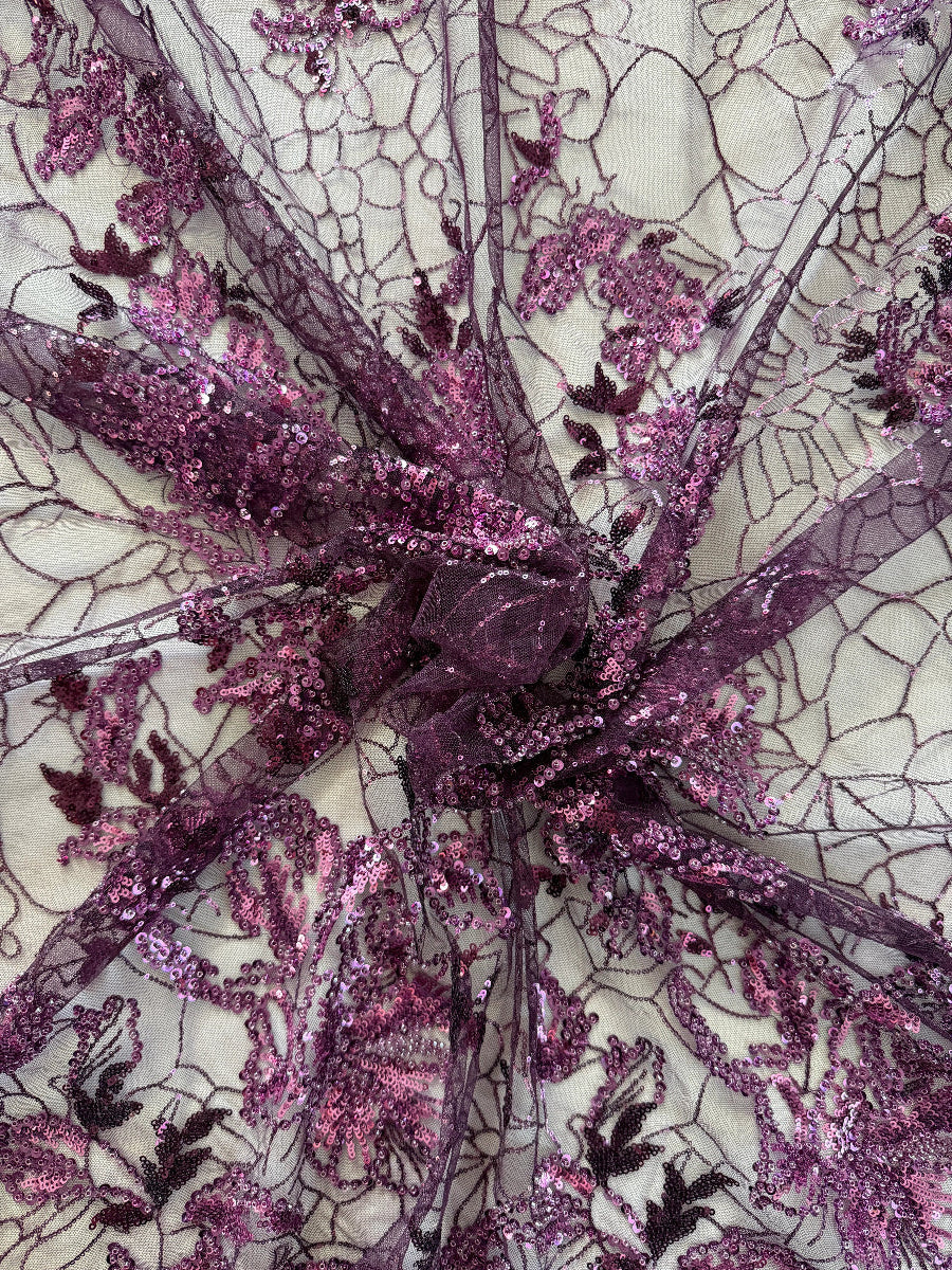 Close up of purple and pink sequin floral embroidery on Alya deep purple Sudanese toub