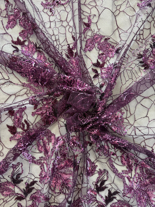 Close up of purple and pink sequin floral embroidery on Alya deep purple Sudanese toub