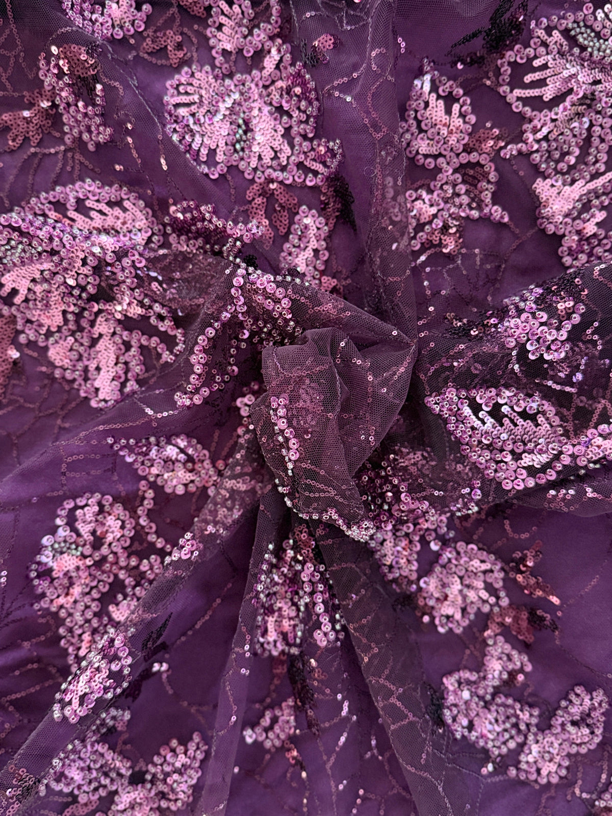 Close up of purple tulle with floral sequin on Alya deep purple Sudanese toub