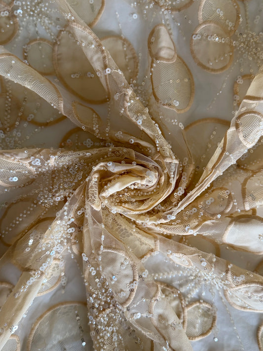 Hala Toub - Beige Sudanese toub fabric detail with sequin and beadwork on white background