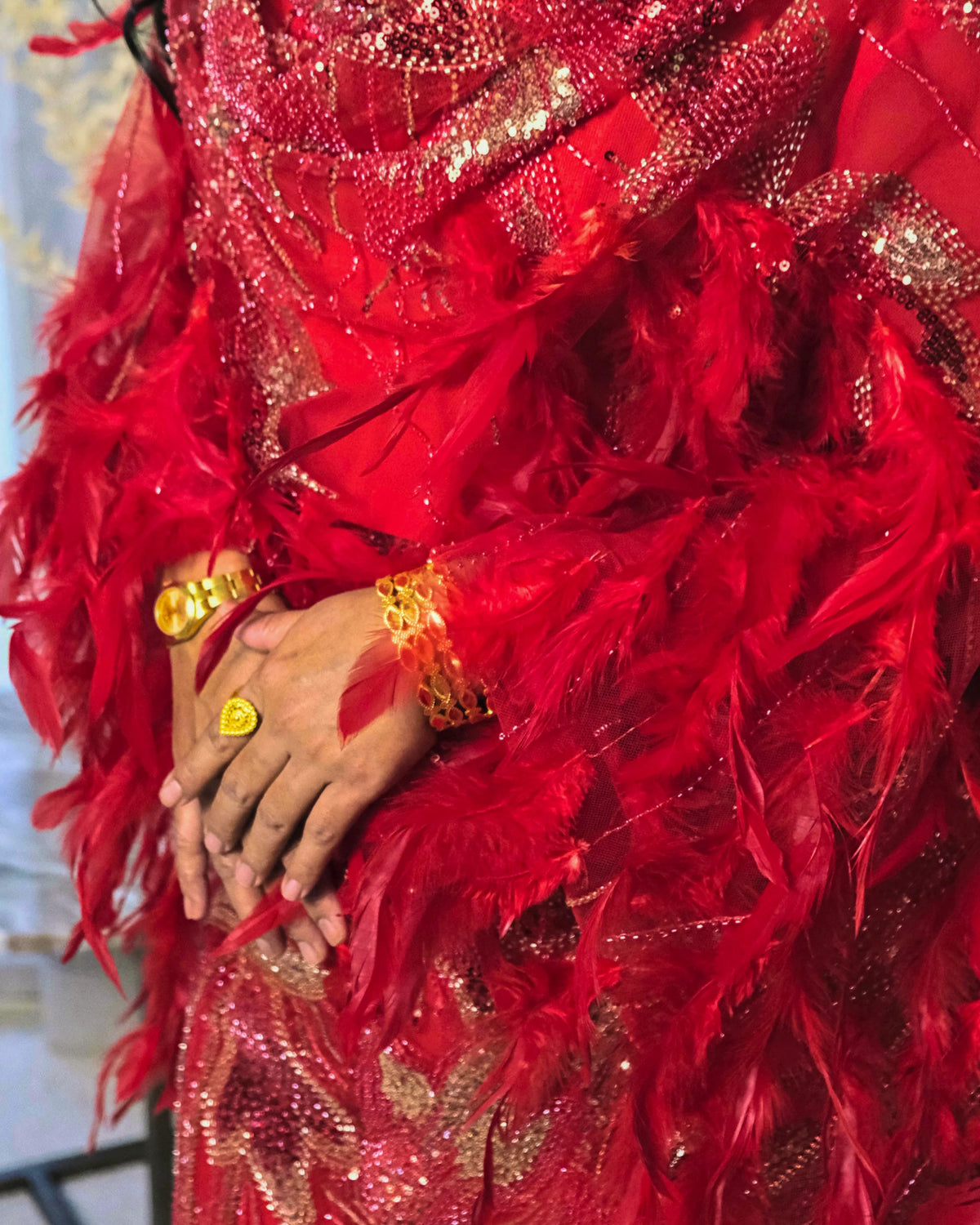 Jamar Toub - Red Sudanese toub with sequin and feather embroidery, close-up view