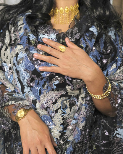 Layl Toub - Black Sudanese toub close-up of sequin floral details