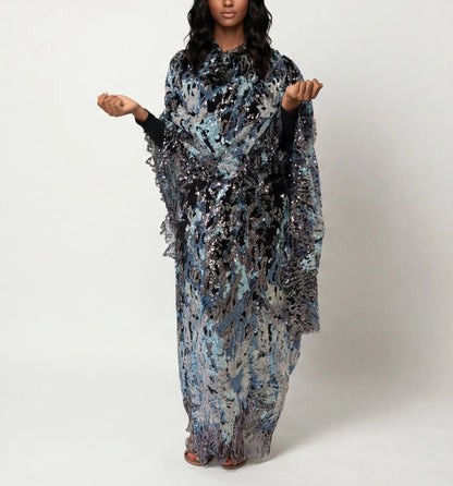 Layl - black Sudanese toub with blue and silver sequin embroidery, front view worn draped
