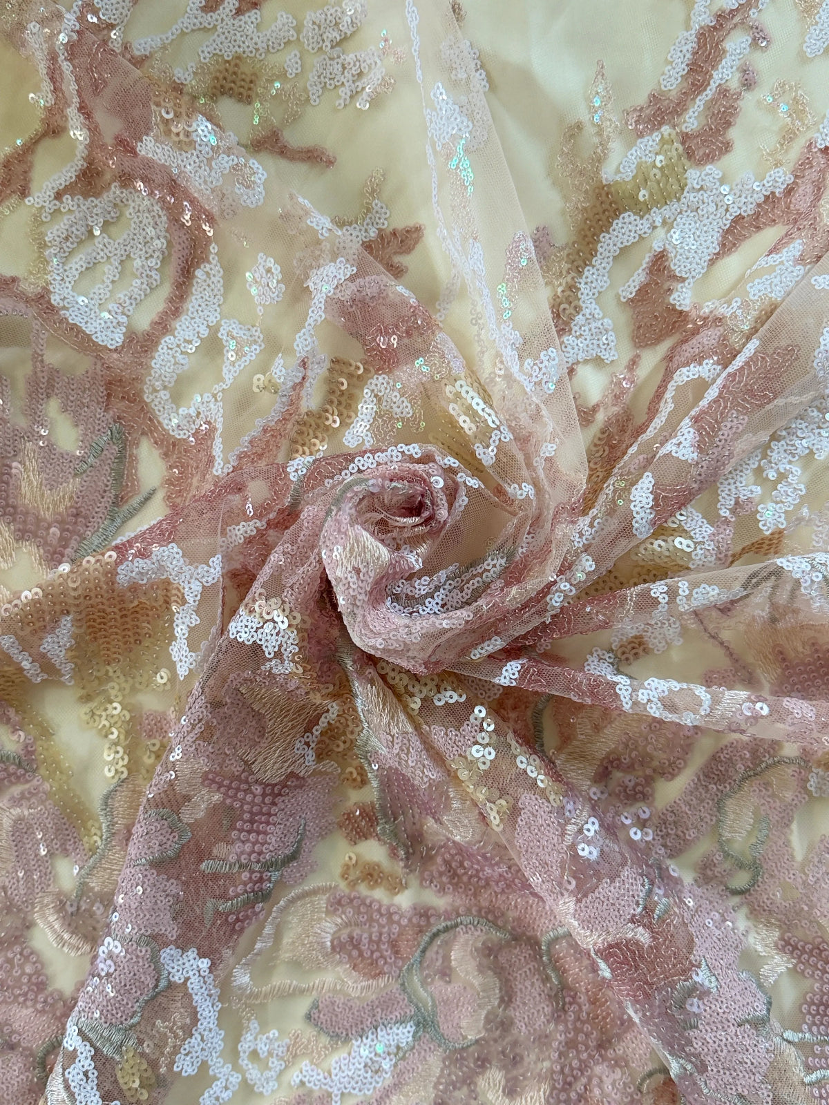 Close up of blush and gold floral sequin on Nahla Sudanese toub