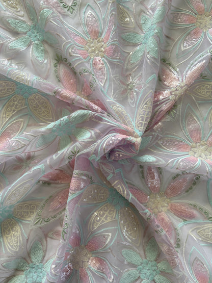 Close up of pink and mint floral sequin embroidery on Rawda Sudanese toub