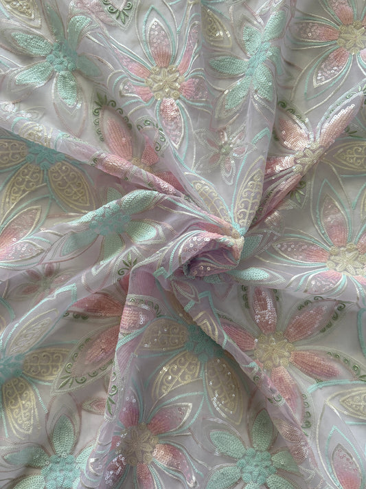Close up of pink and mint floral sequin embroidery on Rawda Sudanese toub
