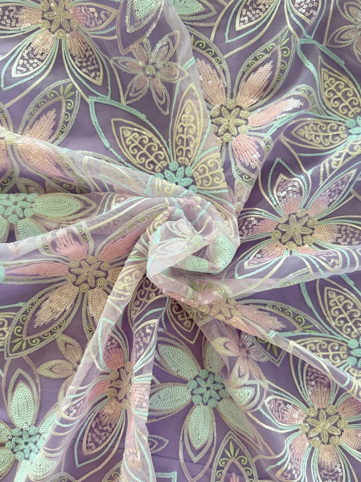 close up of tulle with large pink mint and gold floral sequin detail on Rawda toub