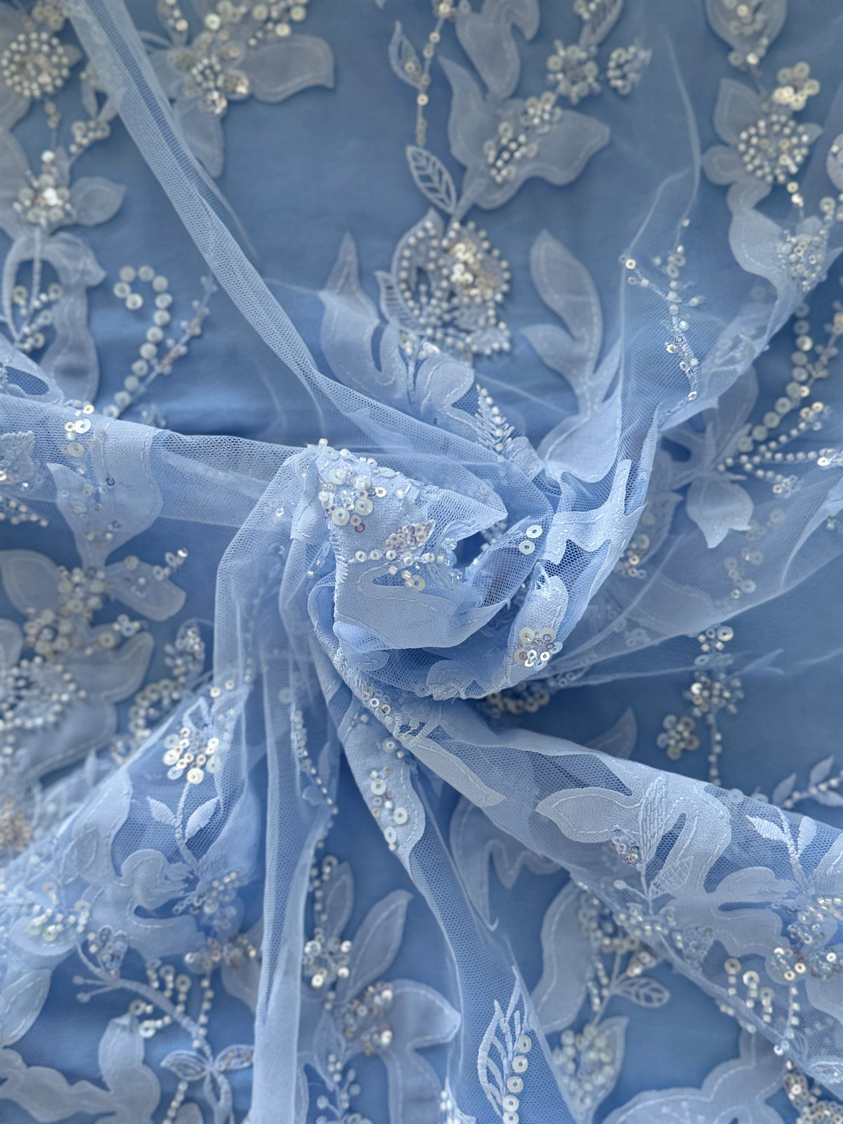 close up of Sky blue tulle with floral embroidery and sequin bead detail on Safa sudanese toub by Asalah