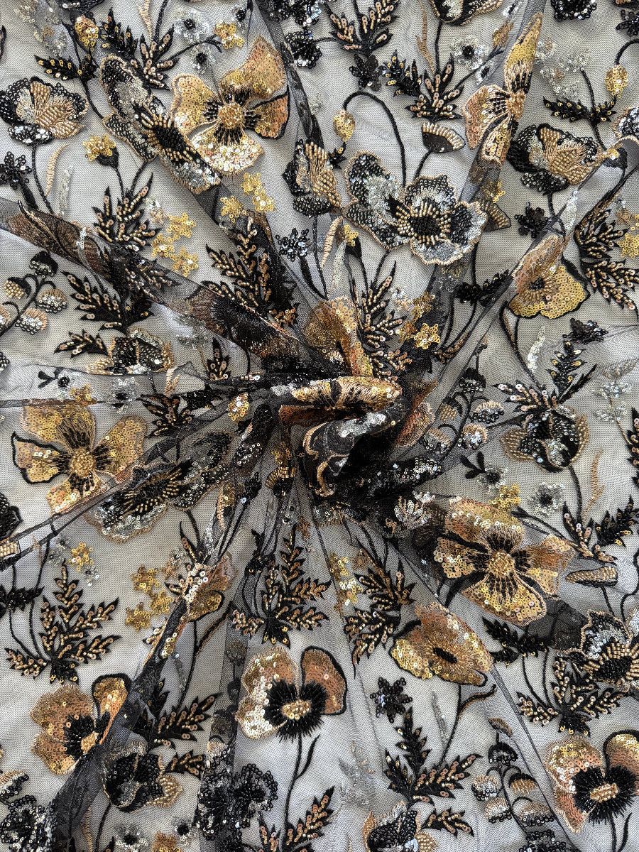 Close up of gold and silver floral sequin embroidery on Samar Sudanese toub