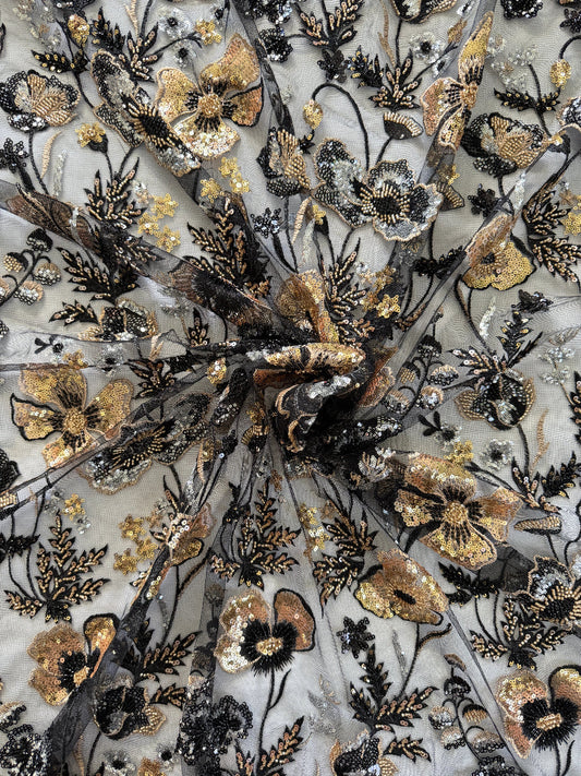 Close up of gold and silver floral sequin embroidery on Samar Sudanese toub