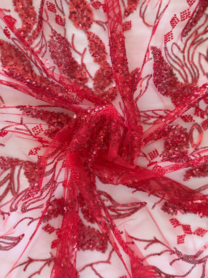 Close up of tonal red sequin botanical embroidery on Shafaq Sudanese toub