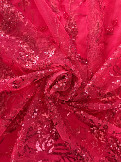 close up of Red tulle with flowing botanical sequin pattern on Shafaq Jirtig toub by Asalah