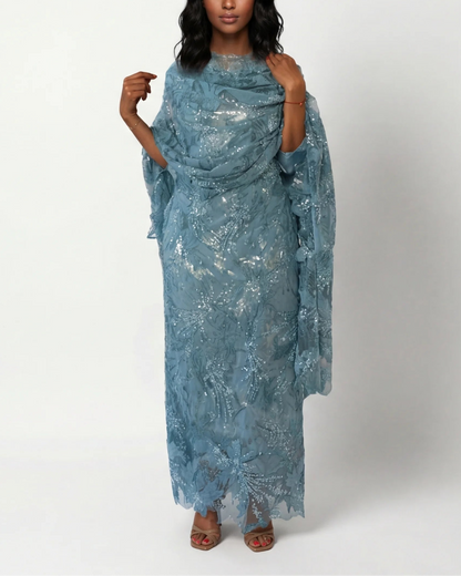Zahrah dusty blue Sudanese toub with tonal floral embroidery and sequin detail, front view worn draped